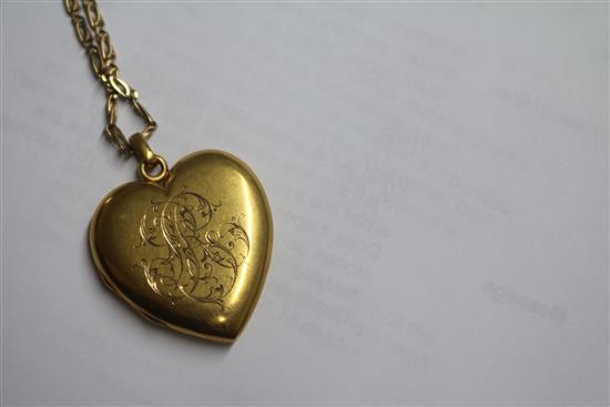 A Victorian yellow metal and gem set heart shaped pendant locket, on a later 9ct gold chain, locket 31mm.